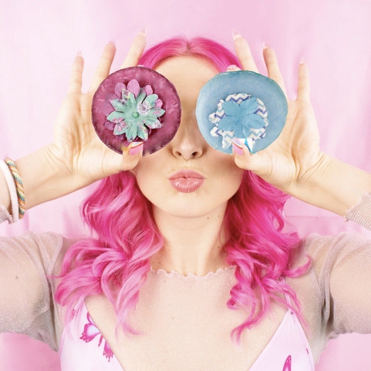artwork of woman with hot pink hair placing AlpacaSoaps Alpaca Soaps hair care bars over her eyes
