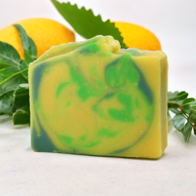 Lemon Verbena Bar Soaps on clean white tile, with lemon and leaves in background, Alpaca Soaps AlpacaSoaps