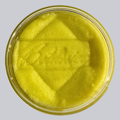 Open jar of sugar body scrub showing the texture, stamped Botanica AlpacaSoaps Alpaca Soaps, yellow color, Lemon Verbena