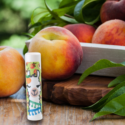  Peach Flavored Lip Balm in photo with peaches Alpaca Soaps, AlpacaSoaps
