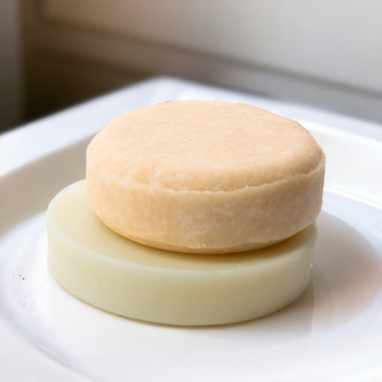 a white plate topped with shampoo and conditioner bar