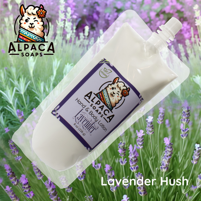a bottle of alpaca lavender hand soap sitting in a field of lavender flowers