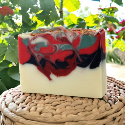 a soap bar sitting on top of a wicker basket, raspberry bushes in the background