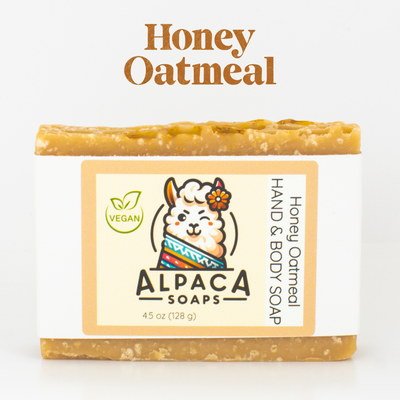 a bar of honey oatmeal soap on a white background